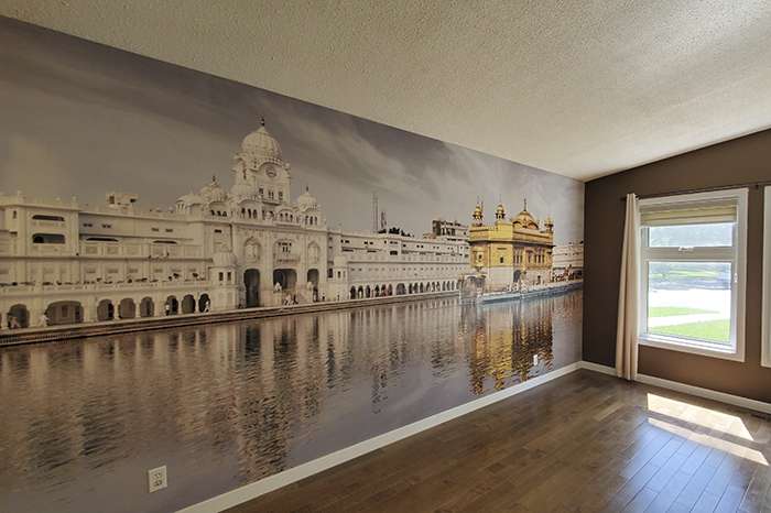 Golden temple wallpaper on the wall with a window